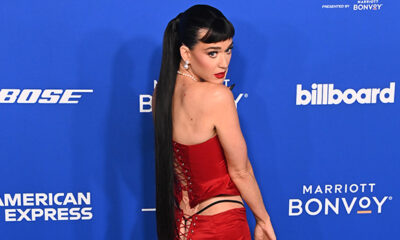 katy-perry-shows-off-g-string-in-red-lace-up-outfit-at-the-2024-billboard-women-in-music-awards:-photos