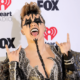 jojo-siwa-exudes-kiss-vibes-in-black-outfit-at-2024-iheartradio-music-awards:-photos