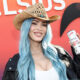 megan-fox-shows-off-blue-hair-with-thigh-high-heels-at-coachella-celsius-event:-photos